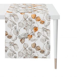 Tischläufer in Grundfabe weiß mit Druck von Lampion (zweigen) in grau- und beige-Tönen sowie orange