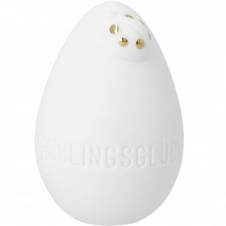 Frontansicht Ei weißes Porzellan unglasiert mit aufgsetztem Glückskäfer mit goldenen Punkten oben auf dem Ei rechts und Prägung "Frühlingsglück" im unteren Bereioch